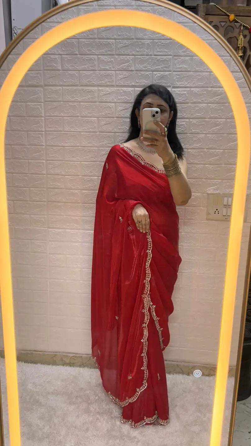 Red organza shimmer saree with cutdana border