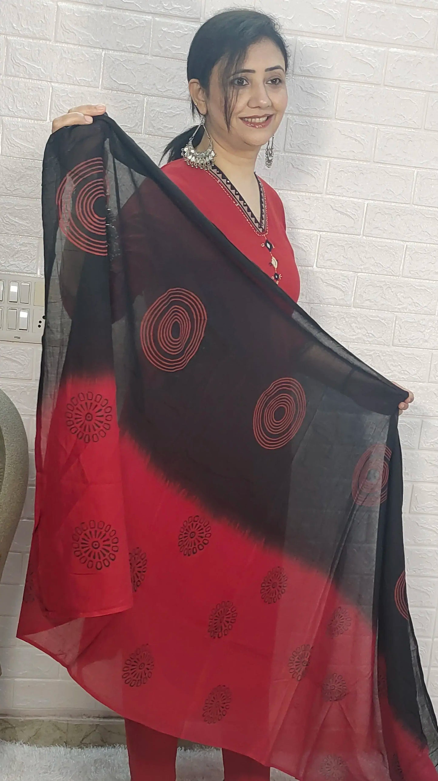 ladies red suit mirror work close up